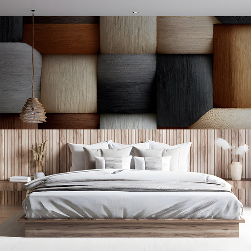 A bedroom featuring the geometric block wallpaper behind a neutral sofa and minimalist coffee table.