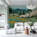 Living room featuring an impressionist meadow landscape mural behind a minimalist beige sofa.