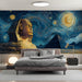 Cozy bedroom area featuring an Egyptian-themed wall mural behind a leather sofa