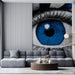 Creative commercial space  showcasing a large-scale graphic eye mural above custom dark wood shelving