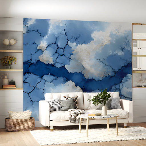 A modern living room featuring the cracked indigo blue mural behind a velvet sofa.