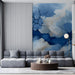 A cozy commercial space with a striking abstract navy blue cracked texture mural on the headboard wall.