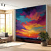 Dramatic sunset wallpaper installed behind a modern minimalist entryway sofa.