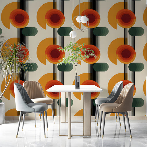 Mid-century modern dining room with geometric orange and green wallpaper behind a tan sofa