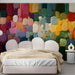 A vibrant impasto abstract mural installed in a modern bedroom with minimalist white furniture.