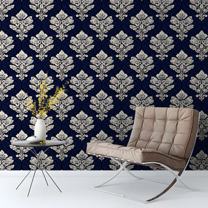 Traditional study with dark navy damask feature wall and elegant wooden furniture.
