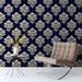 Traditional study with dark navy damask feature wall and elegant wooden furniture.