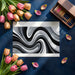 Abstract black and white wave wall mural installed in a contemporary home office.