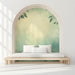 A relaxing reading nook featuring a nature-inspired forest leaf wall mural.