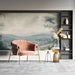 A quiet reading room with a vintage-style landscape wallpaper creating a sense of depth and tranquility.