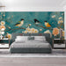A cozy bedroom featuring the bird and floral wallpaper mural as a soft artistic backdrop.
