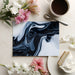 Primary bedroom interior with an abstract charcoal and white wave pattern wall mural