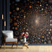 A cozy study with a celestial constellation wall mural.