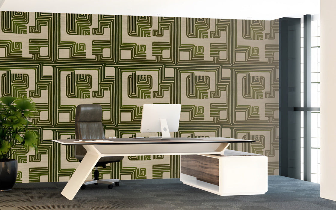 Geometric green wallpaper installed in a professional home office with wooden mid-century furniture.