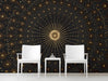 Moody entryway with a central golden sunburst mural behind a dark velvet bed frame