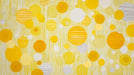 Abstract wallpaper pattern featuring yellow and cream circles with vertical line textures