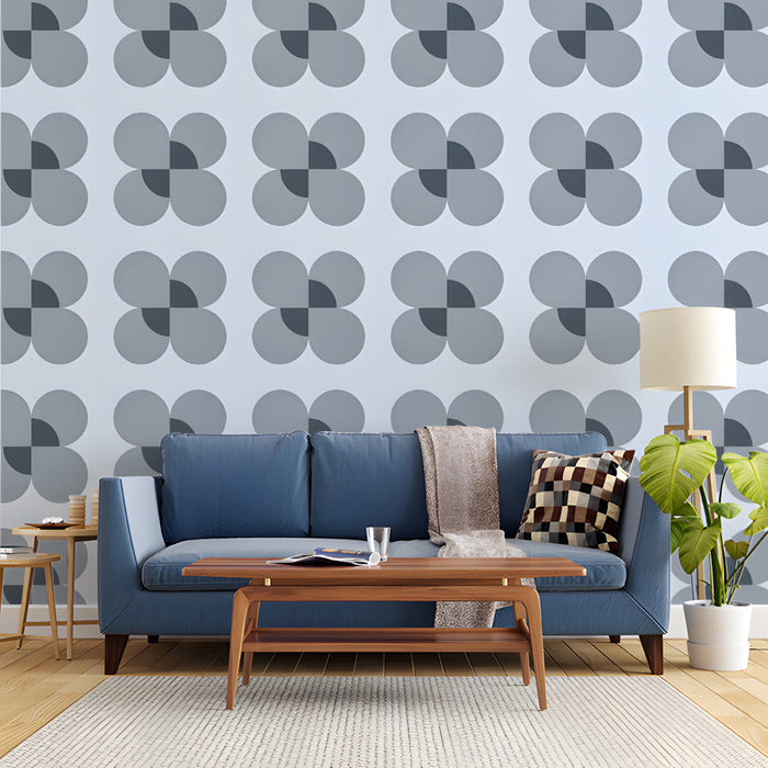 A study wall featuring a soft blue and charcoal geometric flower mural pattern.