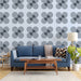 A study wall featuring a soft blue and charcoal geometric flower mural pattern.