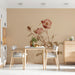 A cozy dining room wall featuring the vintage rose botanical mural above a white linen bedspread.