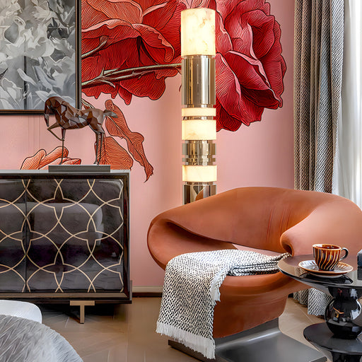 The rose branch wallpaper installed as a soft feature wall behind a white vanity in a dressing room.