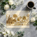A cozy nursery featuring an enchanted forest mural wallpaper with soft cream and gold tones.