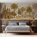 Whimsical bedroom wall featuring a golden castle and unicorn mural wallpaper with antique wooden furniture.