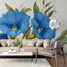 Living room interior featuring a blue floral wall mural behind a minimalist cream sofa