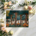 A cozy bedroom wall covered in an enchanted forest mural with teal and ochre illustrated trees.