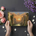 The golden canyon landscape wallpaper installed behind a wooden desk in a home office.