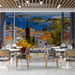 Mediterranean coastal window mural installed in a bright dining room with wooden furniture