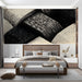 A minimalist bedroom with the black and cream woven pattern providing a graphic, textured backdrop for seating.