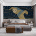 Artistic owl wall mural in a creative bedroom with dark blue shelves