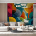Creative home office workspace with a bold abstract geometric wall mural for inspiration