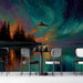 Moody bar with an artistic night sky mural wall and charcoal furniture.