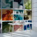 Bright home office featuring an abstract watercolor wave wall mural