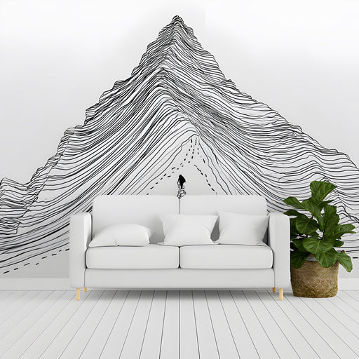 A bright hallway decorated with a sophisticated black ink mountain range wallpaper.