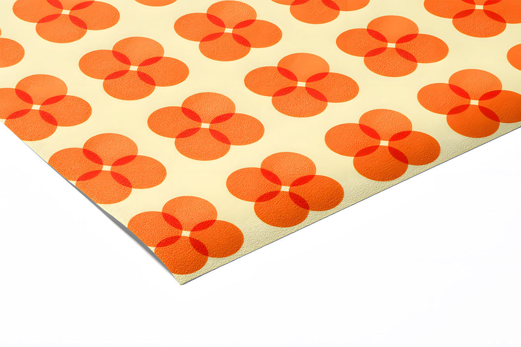 A playful kid's playroom decorated with retro orange flower pattern mural.