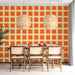 A cozy dining room space featuring a vibrant geometric floral wall mural.