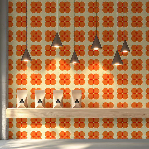 A bright mid-century modern shop featuring orange geometric wallpaper.