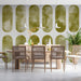 Sophisticated entryway wall decorated with a soft olive geometric mural pattern