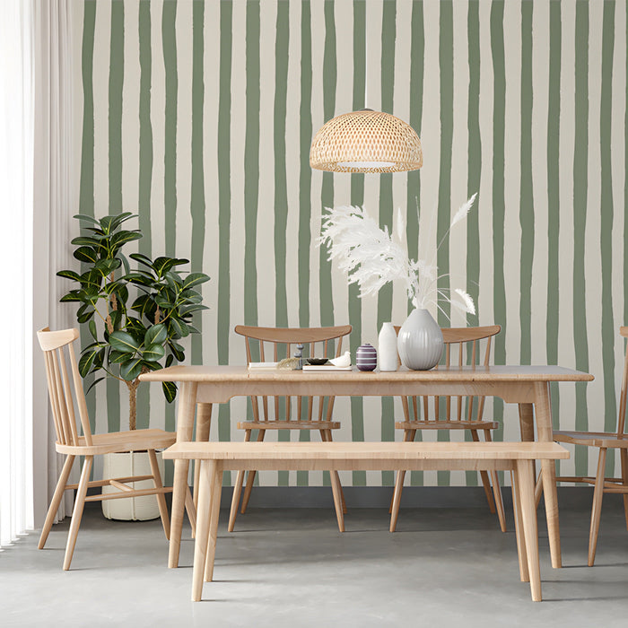 A serene dining room with hand-drawn stripe wallpaper creating a calming, organic backdrop.