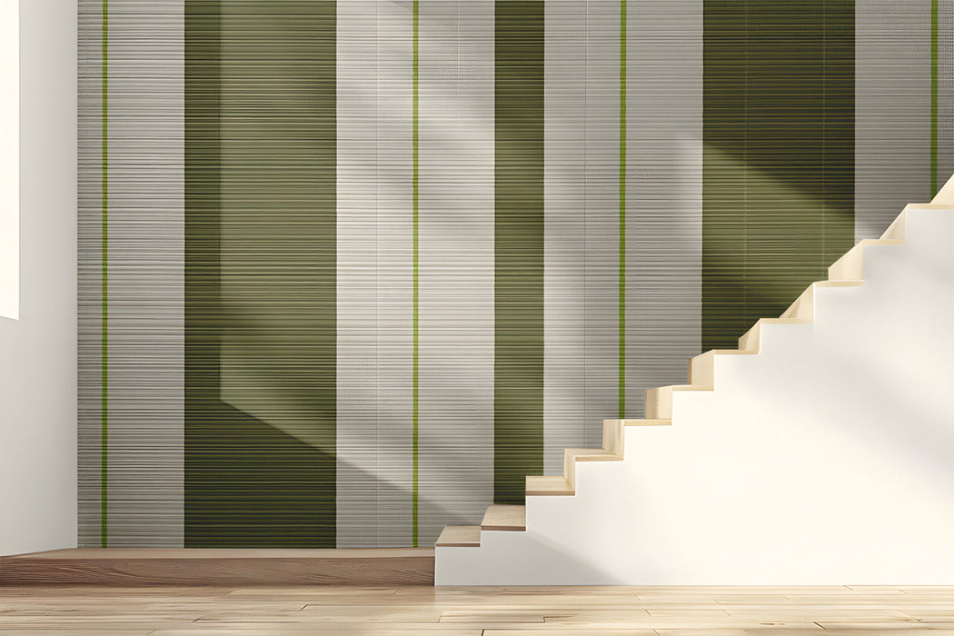A bright, modern entryway featuring vertical olive and cream striped wallpaper.