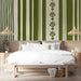 Sophisticated bedroom featuring a green botanical stripe wall mural behind a wooden dining table