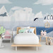 Arctic whale mural installed in a gender-neutral nursery with minimalist wooden crib