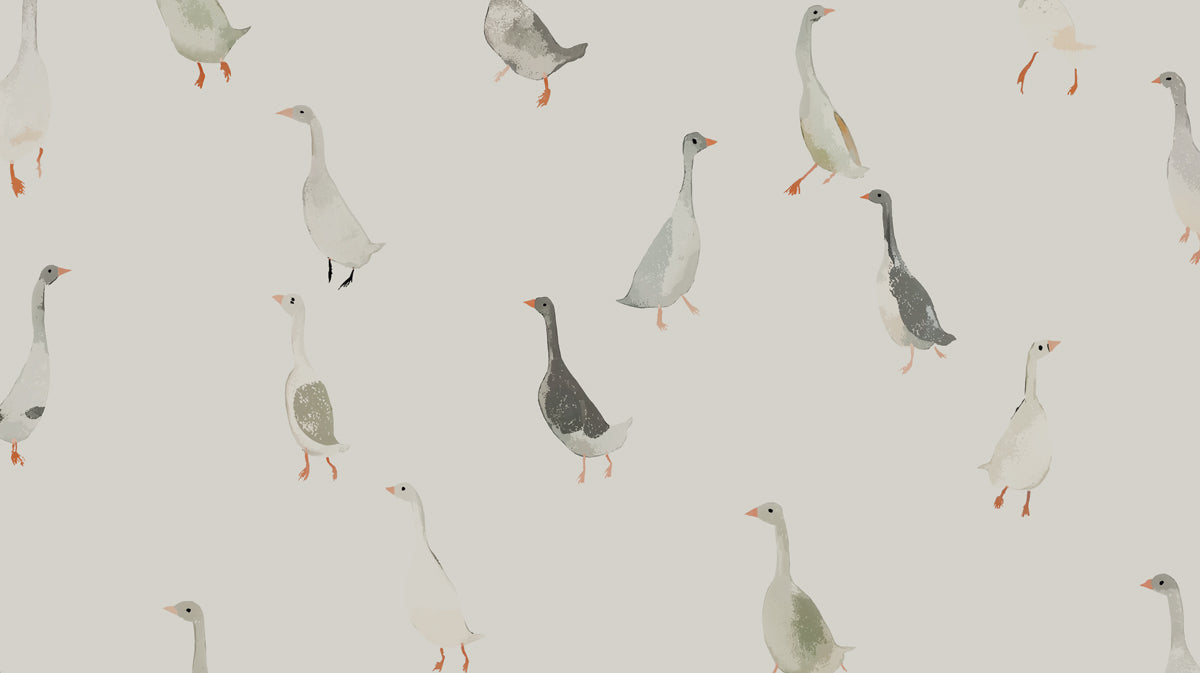 A repeating pattern of hand-painted geese in slate, sage, and white on a soft oatmeal background.