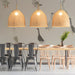A bright, airy bar featuring a subtle, painterly goose wallpaper design.