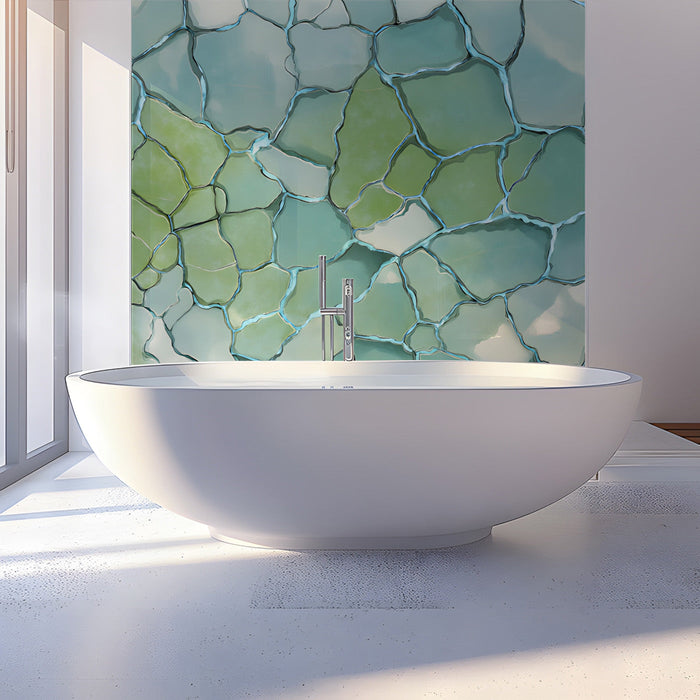 Glacial stone mosaic wallpaper installed in a calming bathroom with light wood furniture.