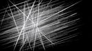 Abstract pattern of sharp white intersecting lines on a deep black background