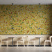 Modern cafe wall covered in yellow confetti sprinkle mural with minimalist white cabinets