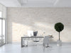 Minimalist office with cream and taupe cloud patterned wallpaper behind a wooden headboard